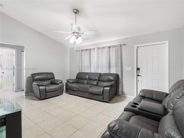 tiled living room with ceiling fan and lofted ceiling