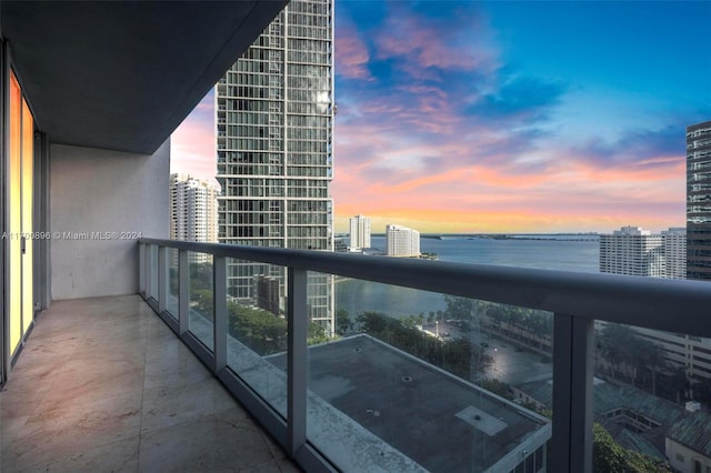 balcony at dusk with a water view