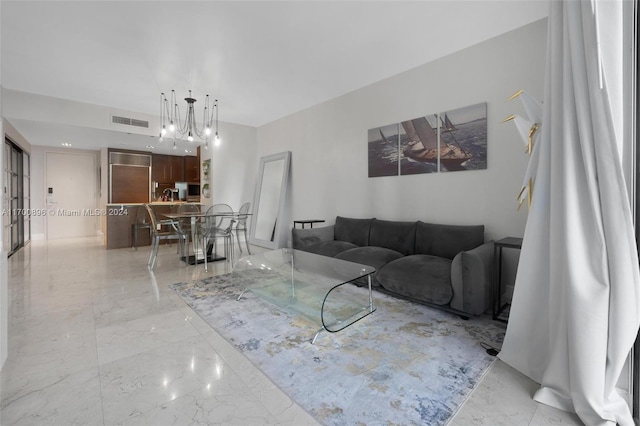 living room featuring a notable chandelier