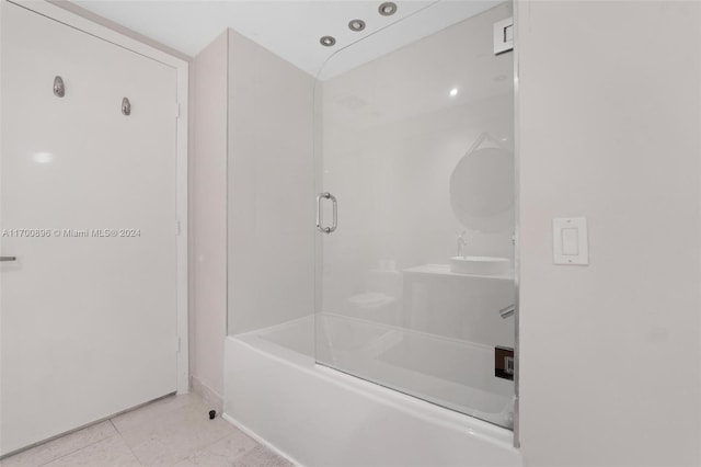 bathroom with tile patterned flooring and enclosed tub / shower combo