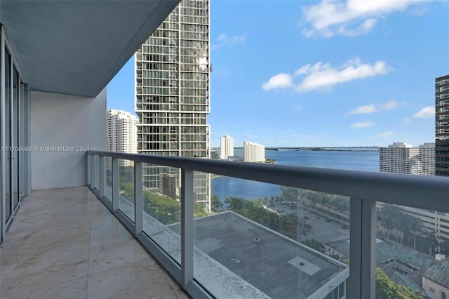 balcony featuring a water view