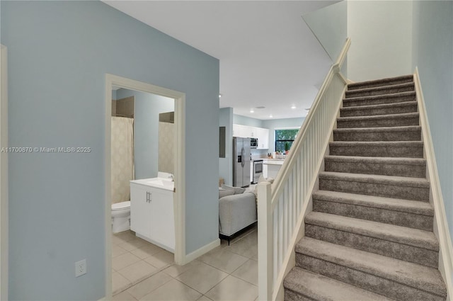 887 NE 211th St Unit 887, Miami, FL 33179 - stairs with baseboards, tile patterned flooring, and recessed lighting