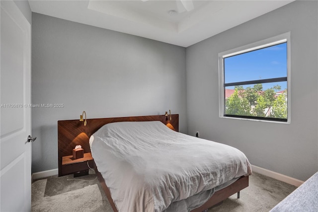 887 NE 211th St Unit 887, Miami, FL 33179 - bedroom featuring light carpet, ceiling fan, a raised ceiling, and baseboards
