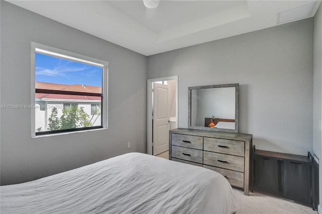 887 NE 211th St Unit 887, Miami, FL 33179 - bedroom featuring visible vents, a tray ceiling, and light colored carpet