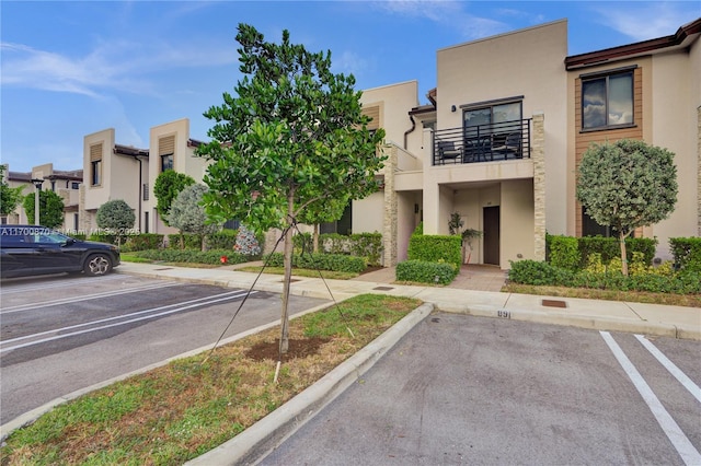 887 NE 211th St Unit 887, Miami, FL 33179 - view of property featuring uncovered parking and a residential view