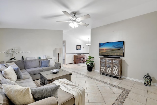 tiled living room featuring ceiling fan with notable chandelier and vaulted ceiling