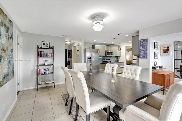 dining area featuring light tile patterned flooring