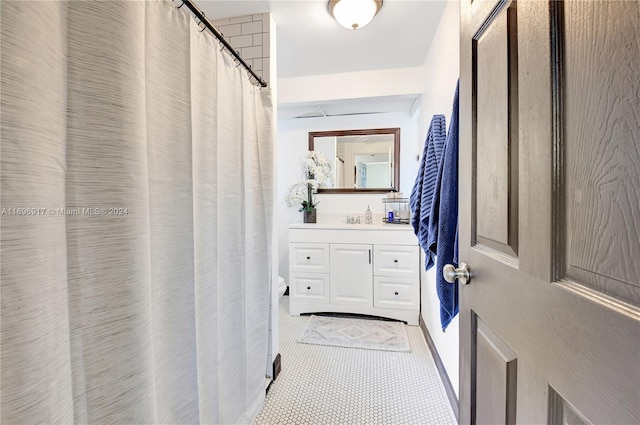 bathroom with tile patterned floors and vanity