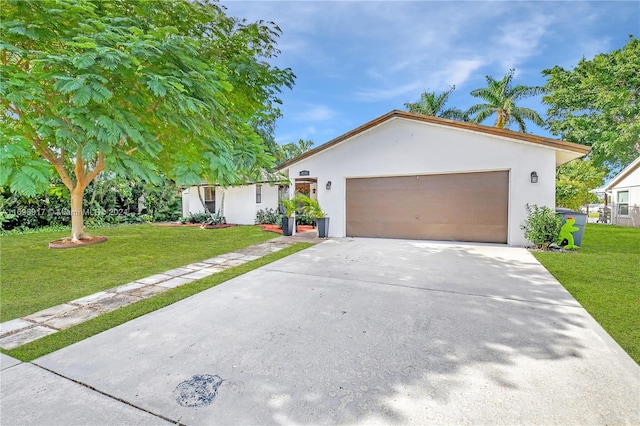 view of front facade with a front yard and a garage