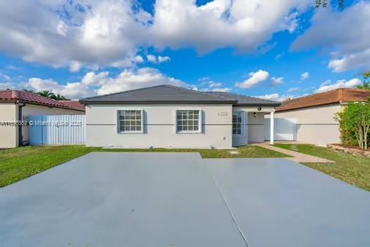 rear view of house with a patio