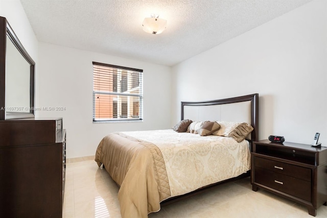 bedroom featuring a textured ceiling