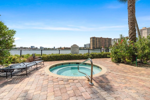 view of pool featuring a community hot tub and a patio