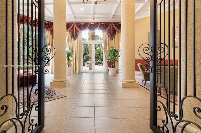 tiled foyer entrance with beam ceiling, ornate columns, french doors, and coffered ceiling