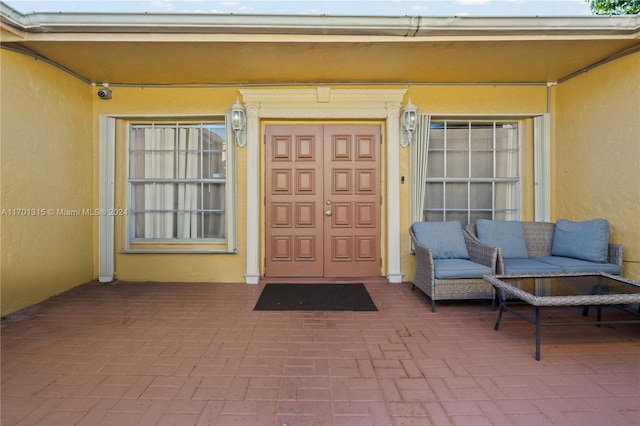 property entrance with a patio area