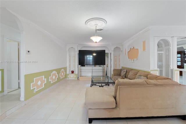 living room with ornamental molding and light tile patterned flooring