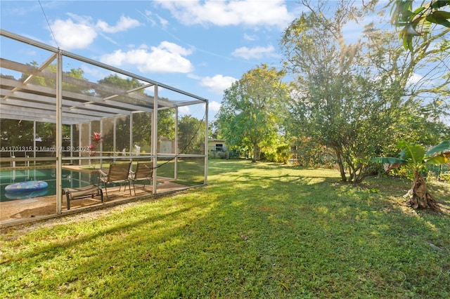 view of yard featuring a patio area and a lanai