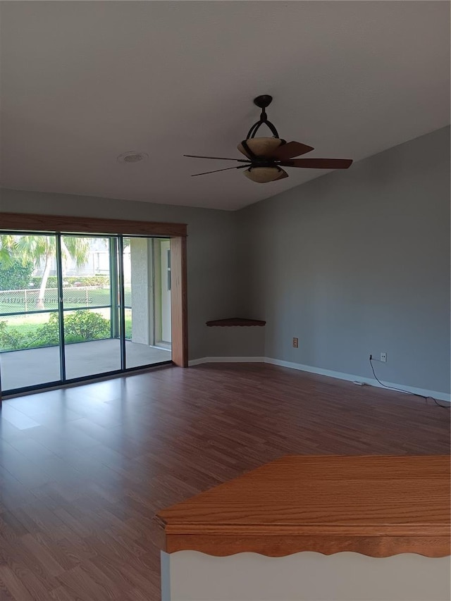 spare room with hardwood / wood-style flooring and ceiling fan