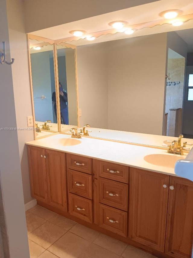 bathroom with tile patterned flooring and vanity