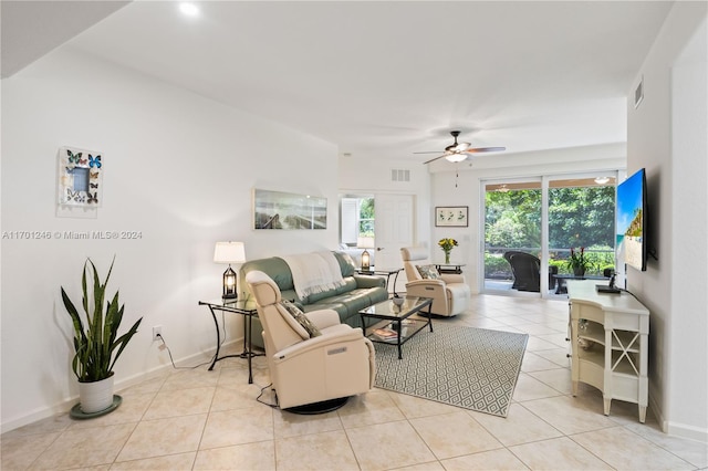 tiled living room featuring ceiling fan