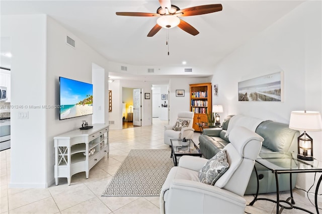 living room with light tile patterned floors and ceiling fan