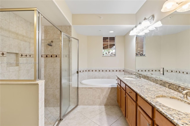 bathroom featuring tile patterned floors, vanity, and separate shower and tub