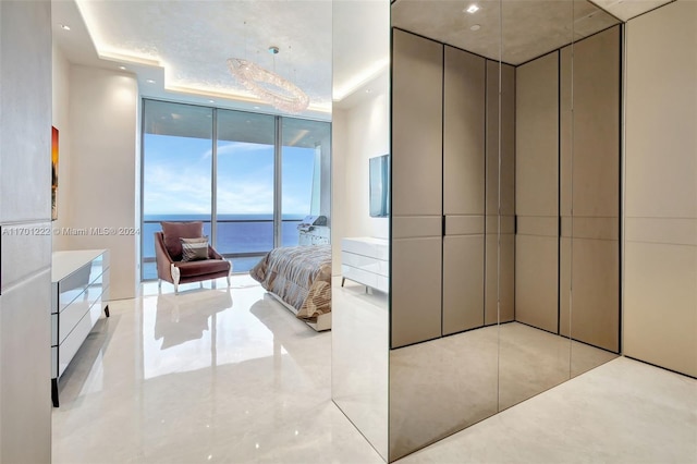 bedroom featuring floor to ceiling windows