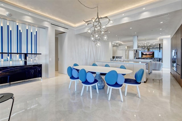 dining room with sink and a notable chandelier