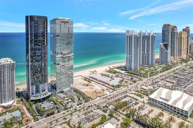 aerial view with a beach view and a water view