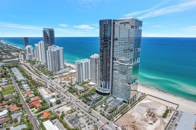 bird's eye view with a view of the beach and a water view