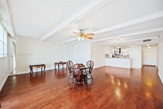 dining space with beamed ceiling, dark hardwood / wood-style flooring, and ceiling fan