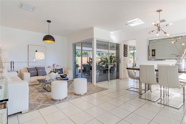 tiled living room with a chandelier