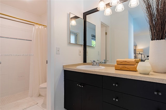 bathroom featuring tile patterned flooring, vanity, toilet, and walk in shower