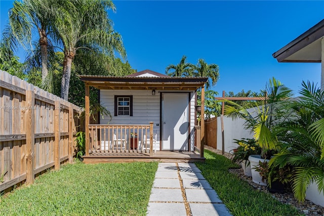 view of outbuilding with a lawn