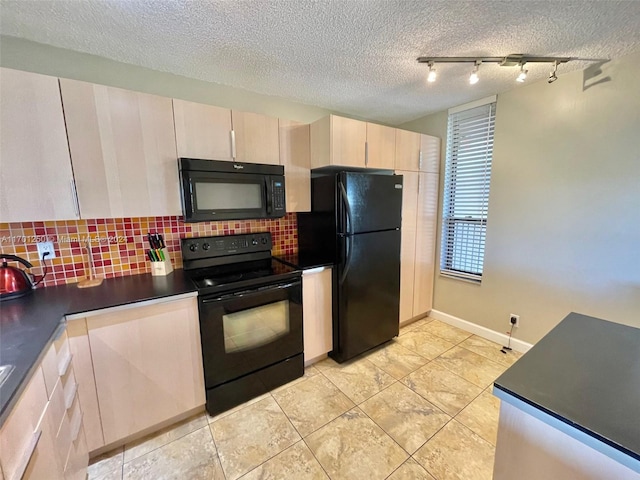 kitchen featuring black appliances, a textured ceiling, and tasteful backsplash