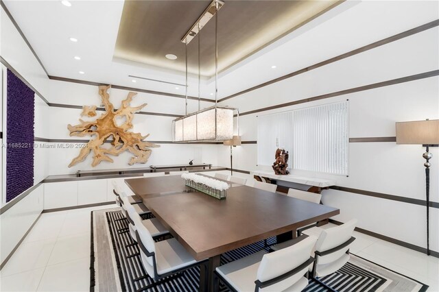 271 N Hibiscus Dr, Miami Beach, FL 33139 - dining space featuring a tray ceiling, recessed lighting, and light tile patterned floors