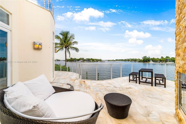 view of patio featuring a water view