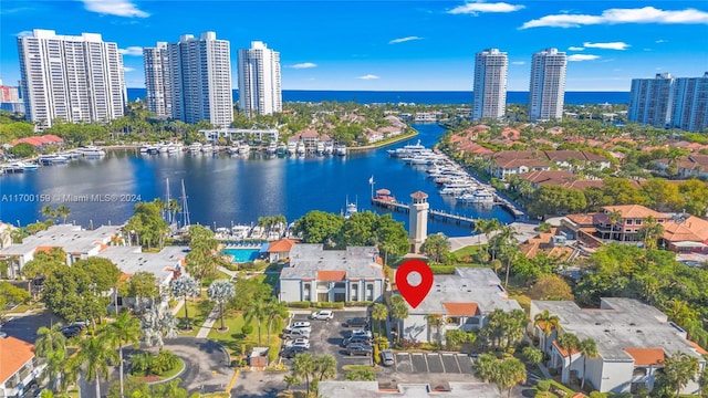 birds eye view of property with a water view