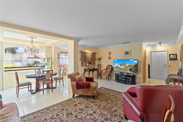 tiled living room featuring crown molding and a chandelier