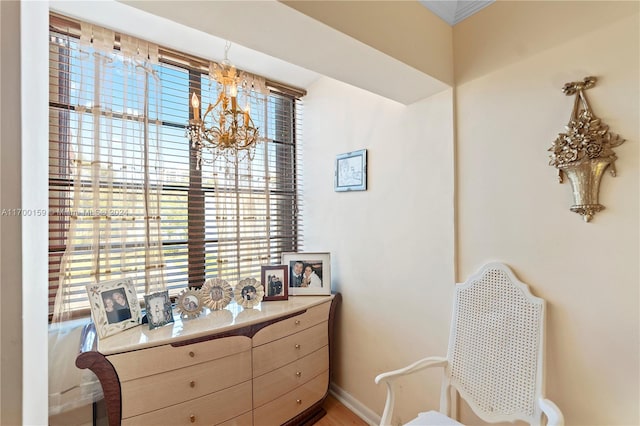 sitting room featuring an inviting chandelier