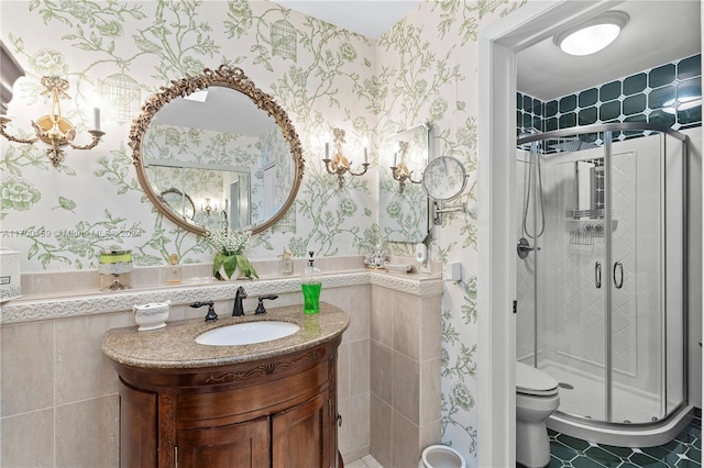 bathroom with walk in shower, vanity, and toilet