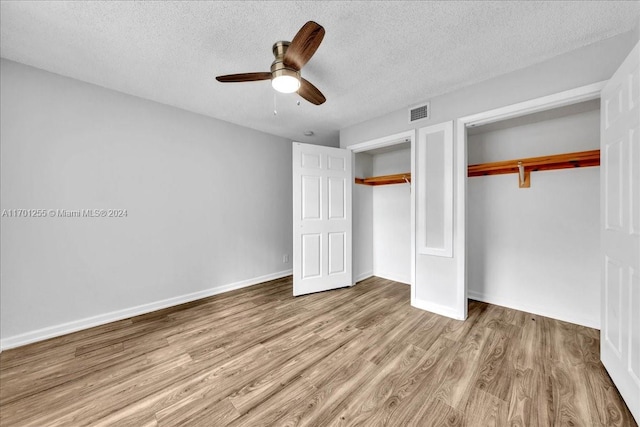 unfurnished bedroom with ceiling fan, a textured ceiling, and light hardwood / wood-style flooring