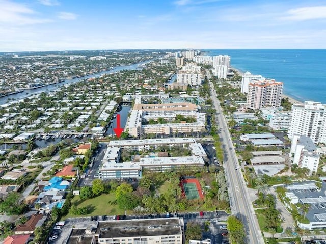 birds eye view of property with a water view