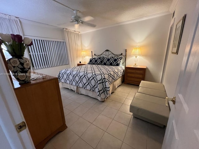 bedroom featuring a textured ceiling, ceiling fan, ornamental molding, and light tile patterned flooring