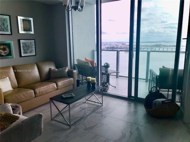 2900 NE 7th Ave Unit 3608, Miami, FL 33137 - living area featuring a chandelier, floor to ceiling windows, and marble look tile flooring