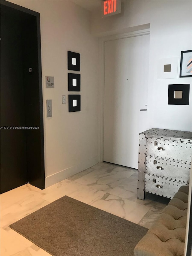 2900 NE 7th Ave Unit 3608, Miami, FL 33137 - hallway with elevator and marble finish floors