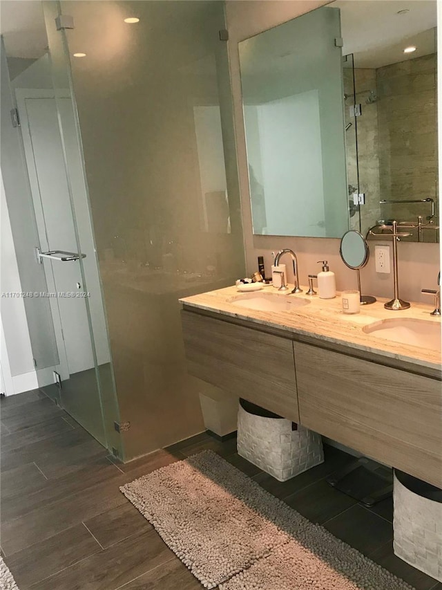 2900 NE 7th Ave Unit 3608, Miami, FL 33137 - bathroom with double vanity, a stall shower, and wood finished floors