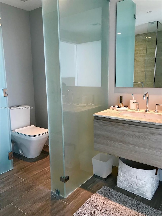 2900 NE 7th Ave Unit 3608, Miami, FL 33137 - bathroom featuring a stall shower, wood finished floors, and vanity