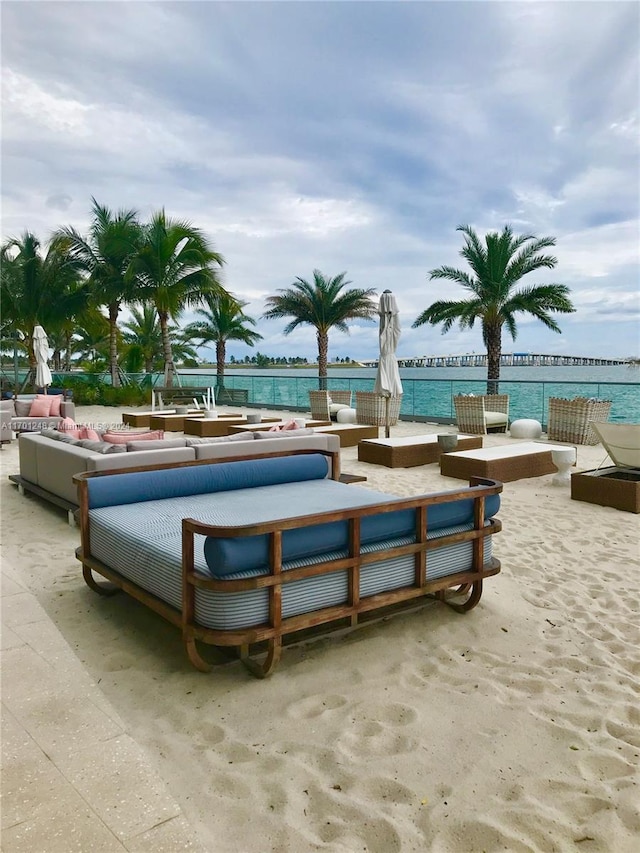 2900 NE 7th Ave Unit 3608, Miami, FL 33137 - surrounding community with an outdoor living space with a fire pit, a patio area, and a water view