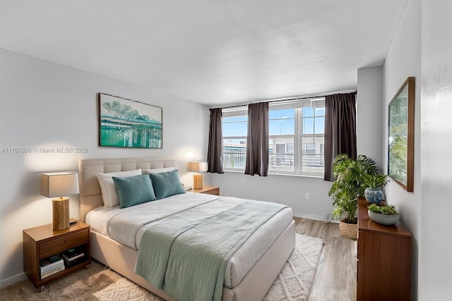 bedroom featuring light wood-type flooring