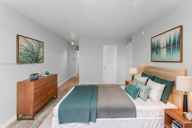 bedroom with light hardwood / wood-style floors